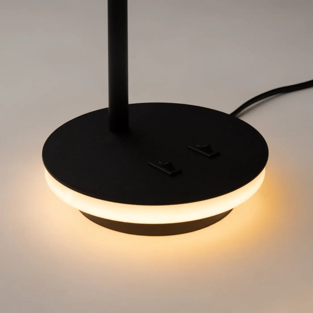 Lampe à poser noire ronde avec rétroéclairage décoratif et liseuse led pour une ambiance chaleureuse moderne