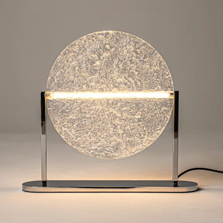 Lampe à poser moderne mangata avec verre martelé translucide et structure argentée en métal chromé