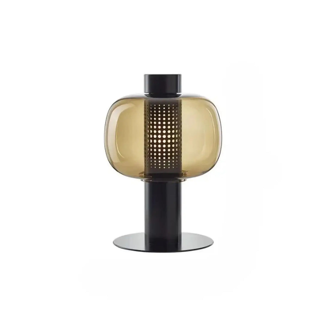 Lampe de table vetra en verre coloré ambré avec base en métal noir et colonne perforée design moderne pour table contemporaine