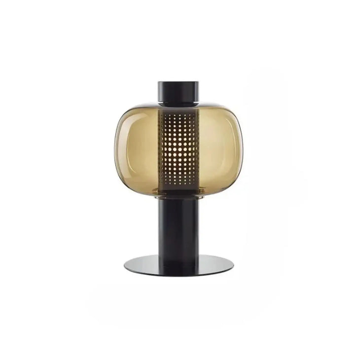 Lampe de table vetra en verre coloré ambré avec base en métal noir et colonne perforée design moderne pour table contemporaine