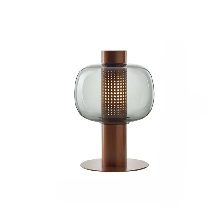 Lampe de table vetra avec verre coloré gris translucide et cylindre perforé bronze sur base cuivre design moderne