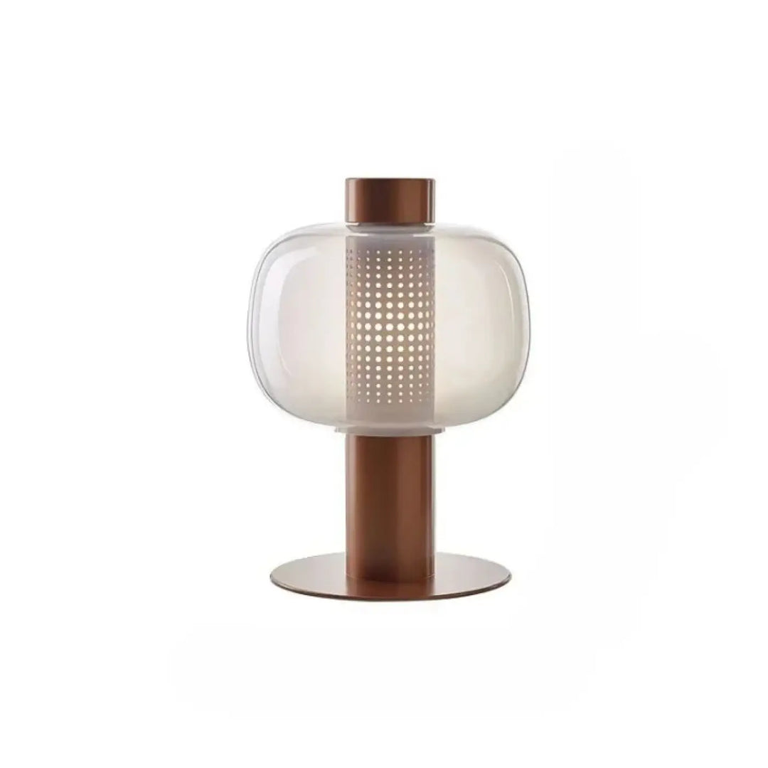Lampe de table vetra avec abat-jour en verre coloré translucide à perforations circulaires et base métal cuivré design moderne