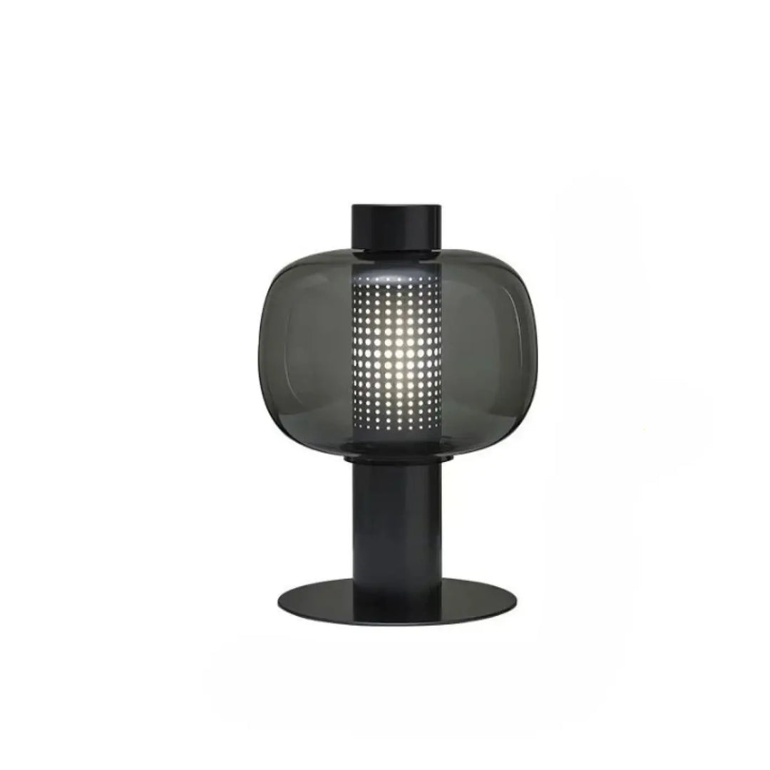 Lampe de table vetra en verre coloré noir avec colonne centrale perforée pour table contemporaine au design moderne