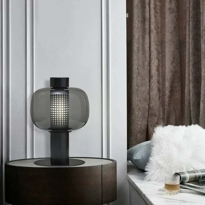 Lampe de table noire et grise en verre coloré perforé avec base cylindrique pour table contemporaine au design moderne