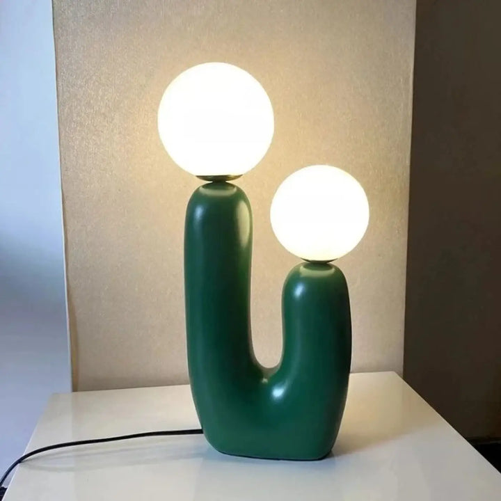 Lampe de table tsilo en céramique vert émeraude avec deux ampoules sphériques blanches lumineuses sont-elles incluses