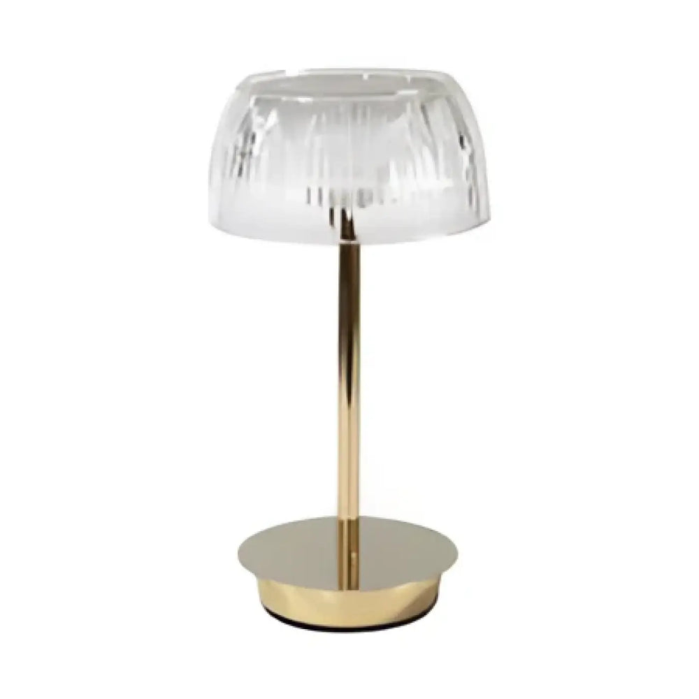 Lampe de table eclatia avec abat-jour en verre facetté transparent sur tige et base circulaire à finition dorée élégante