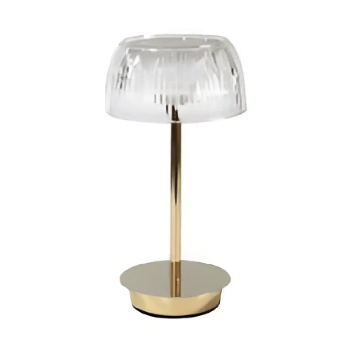 Lampe de table eclatia avec abat-jour en verre facetté transparent sur tige et base circulaire à finition dorée élégante