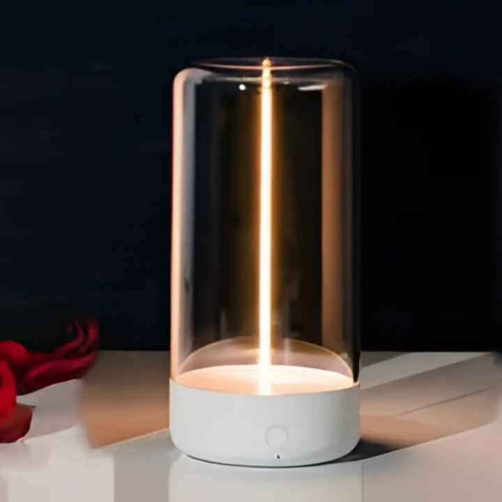 Lampe de table mirea avec base blanche minimaliste et design lumineux original en verre cylindrique avec filament flexible