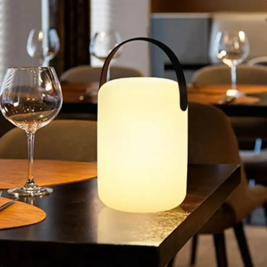 Lampe de table lumina led cylindrique blanche avec poignée noire en fil design pour décoration intérieure élégante