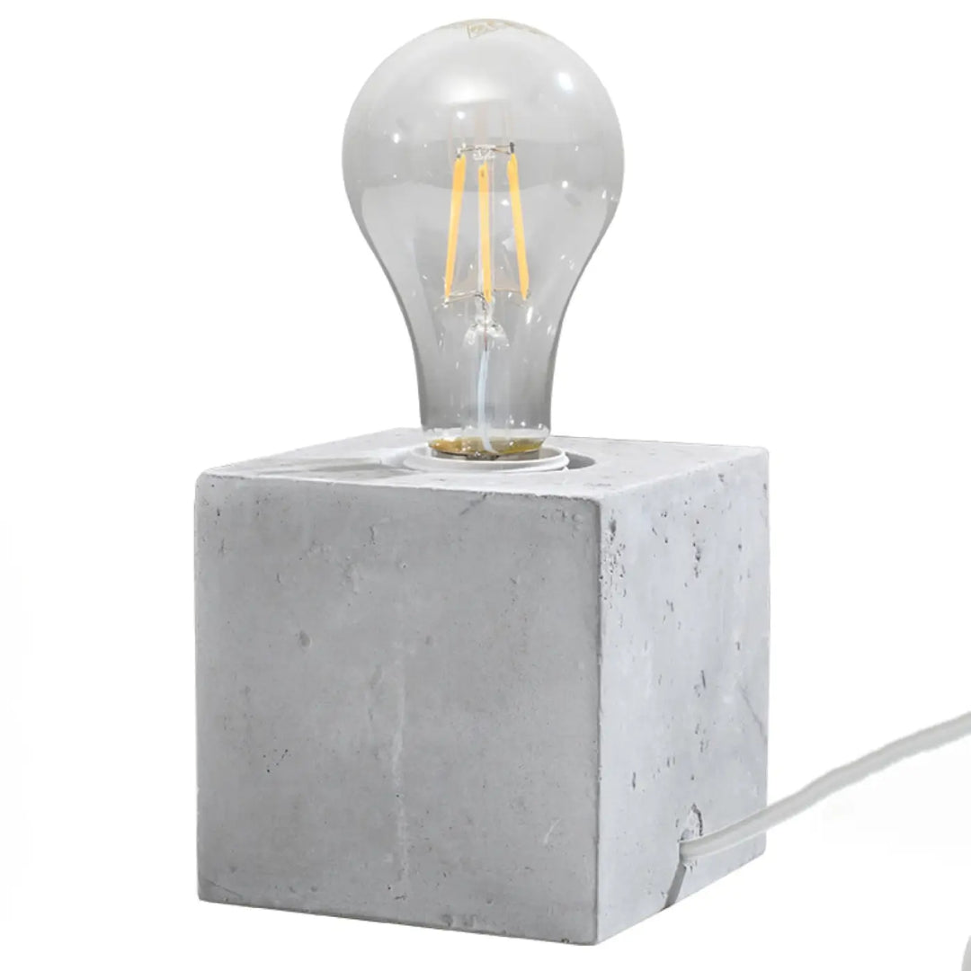 Lampe de table bureau ariz en béton ariz avec ampoule en verre clair et filament visible pour style loft moderne