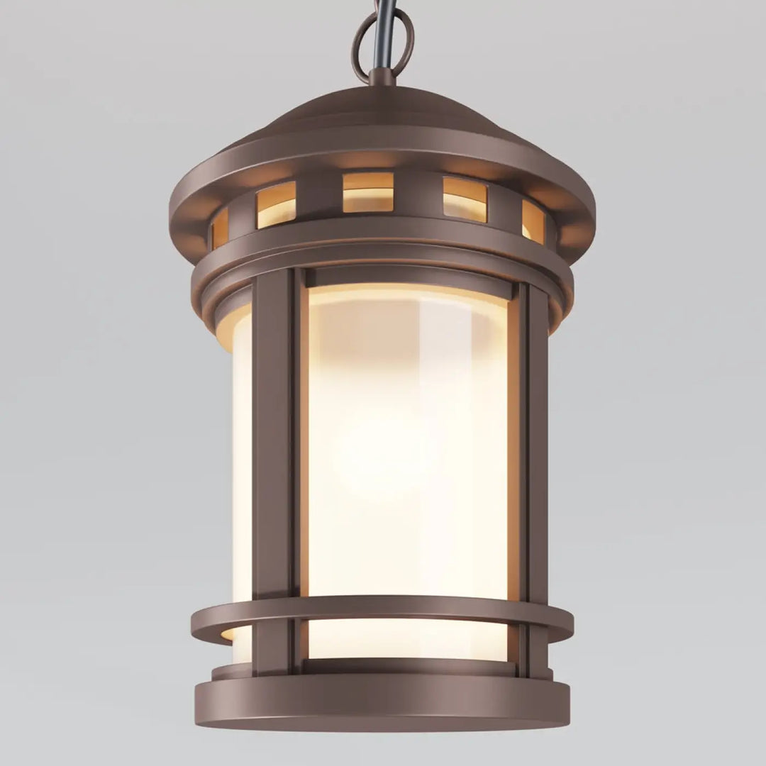 Lanterne suspendue salamanaca en bronze avec panneaux de verre dépoli diffusant une lumière chaude idéale aux porches