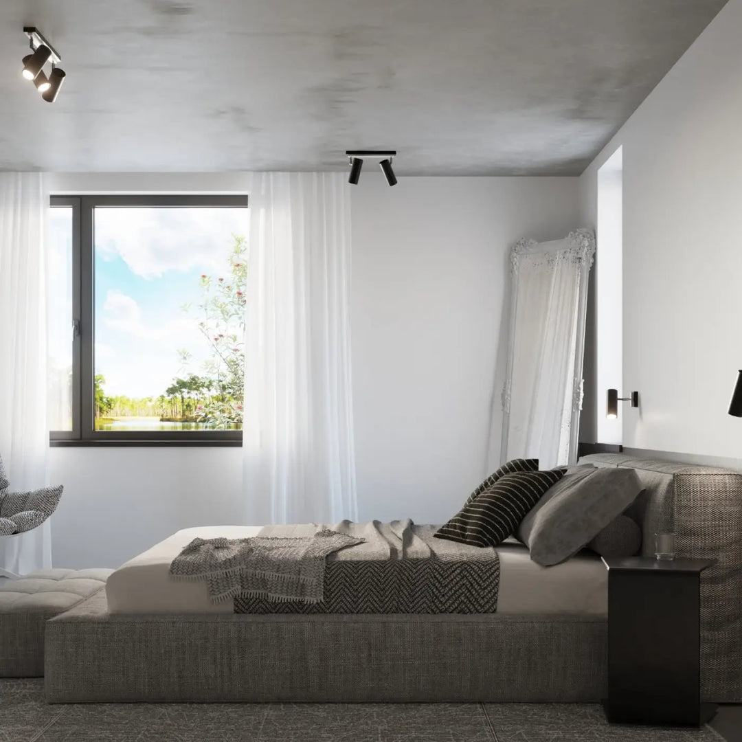 Luminaire plafonnier direzione 2 noir avec éclairage élégant installé au-dessus d un plafond minimaliste contemporain
