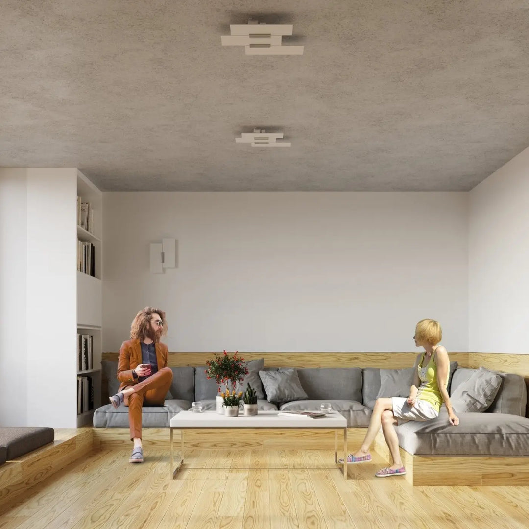 Luminaire plafonnier fabiano avec design intemporel et gris élégant sur canapé sectionnel en bois avec coussins gris