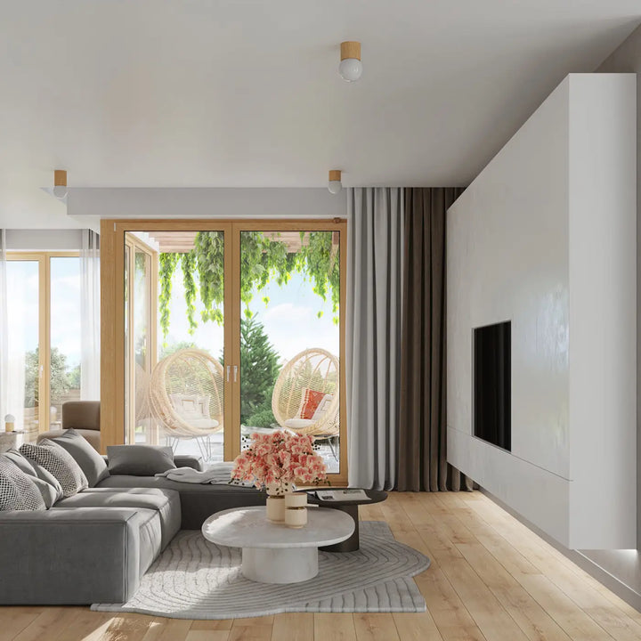Luminaire plafonnier boomo 8 combiné à un canapé sectionnel gris avec coussins à motifs reflétant un style raffiné et minimalisme scandinave