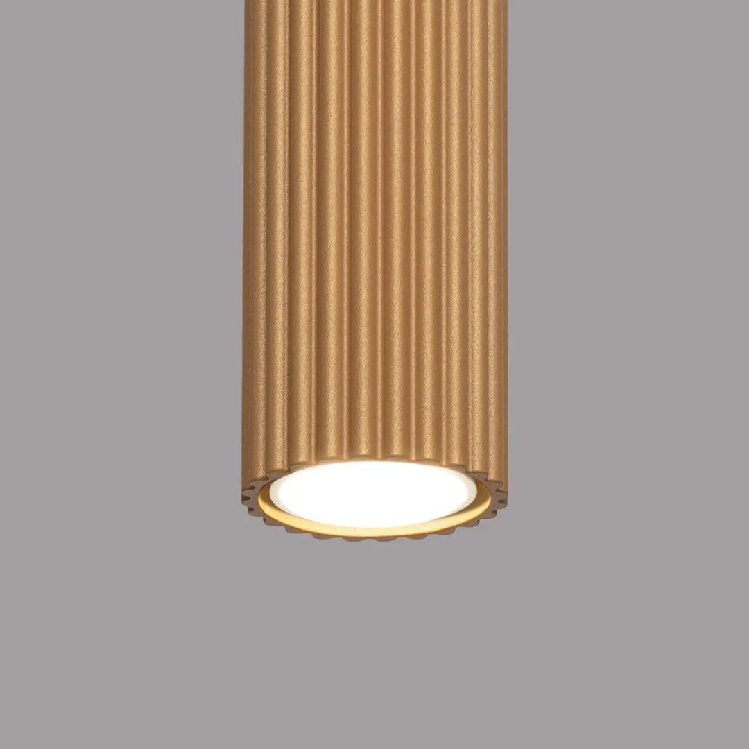 Plafonnier karbon or design minimaliste cylindrique avec texture cannelée verticale et base circulaire lumineuse