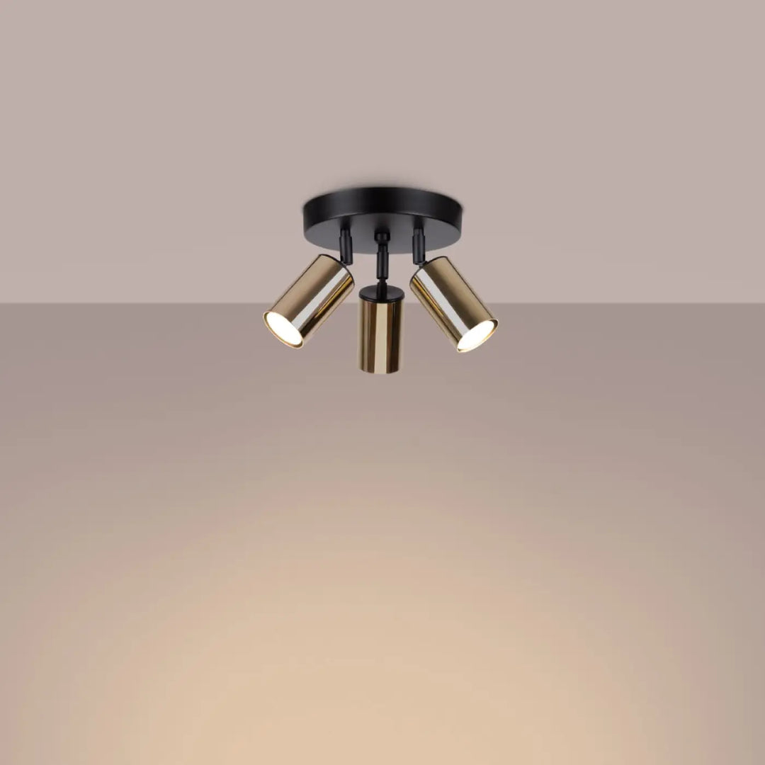 Luminaire plafonnier winx 3p noir avec trois spots cylindriques réglables finition laiton et base noire mate allie design moderne