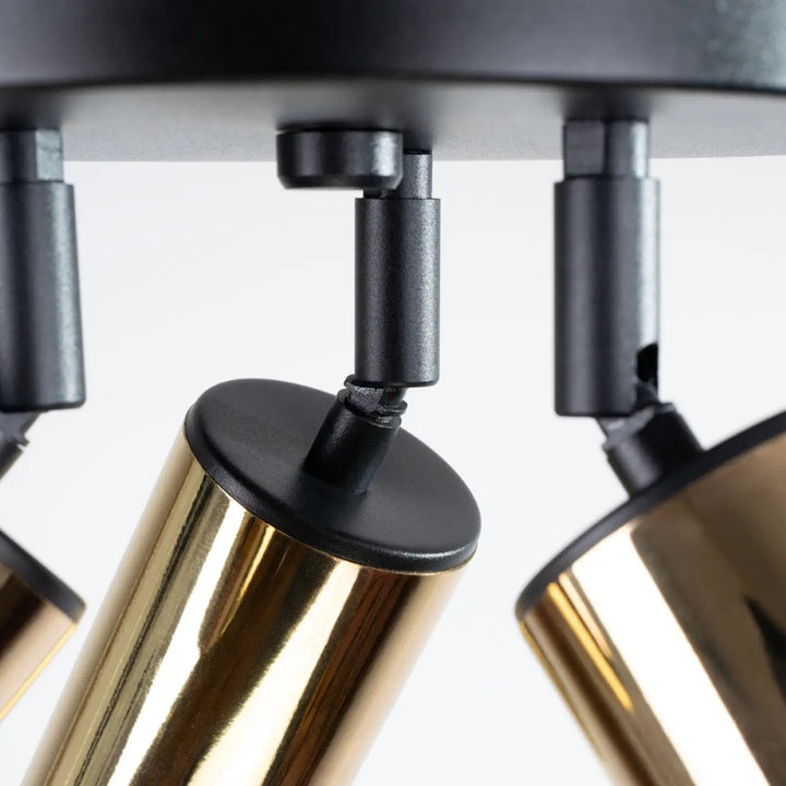 Luminaire plafonnier winx 3p noir en métal noir et doré avec têtes orientables allie design moderne et fonctionnalité