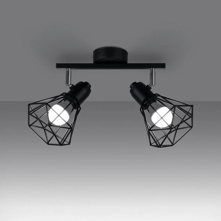 Luminaire plafonnier série artemis noir avec deux spots réglables créant une atmosphère intime moderne