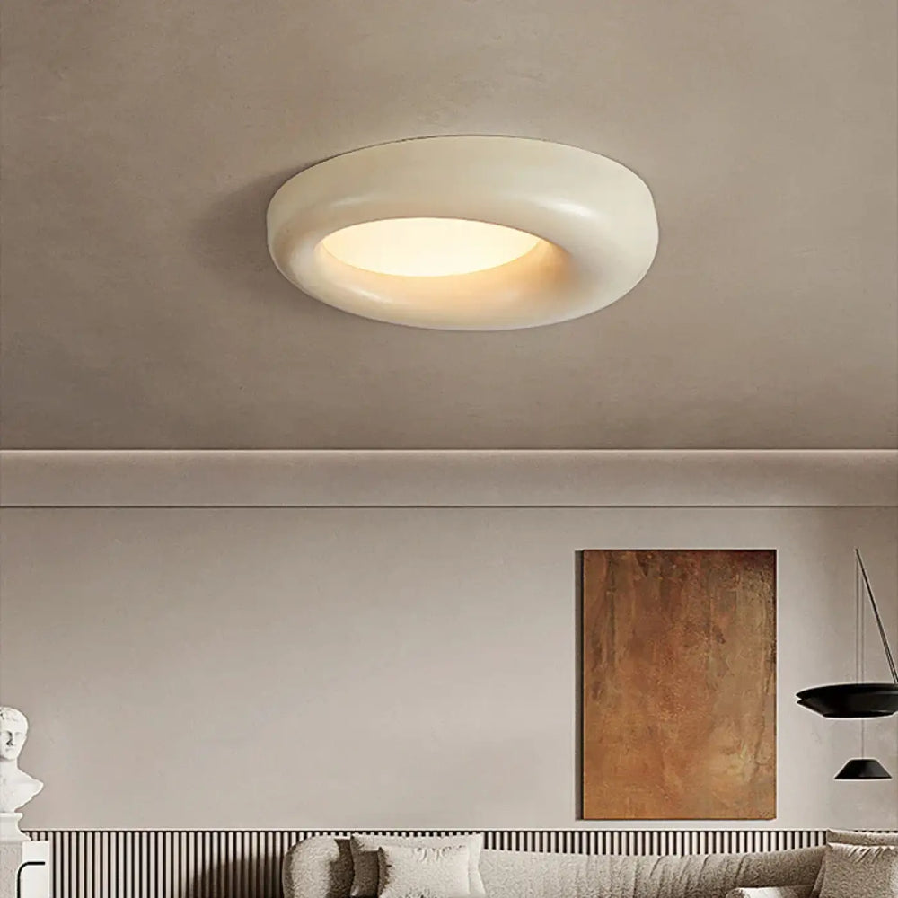 Luminaire plafonnier torix led style en vert avocat avec design circulaire blanc et lumière ambiante chaleureuse