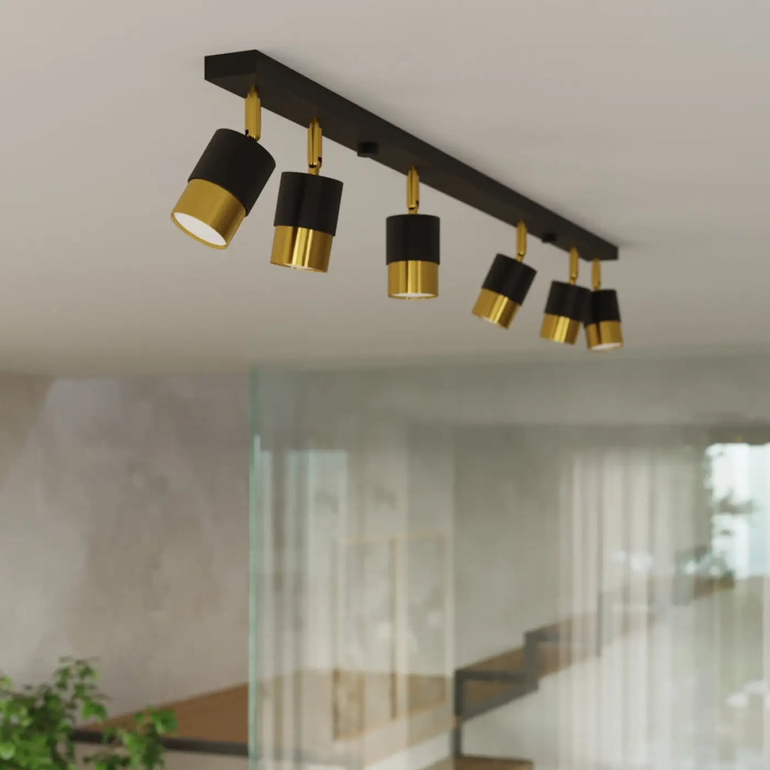 Plafonnier applique moderne noir et doré avec cinq spots réglables de la collection nero pour totale liberté d’éclairage