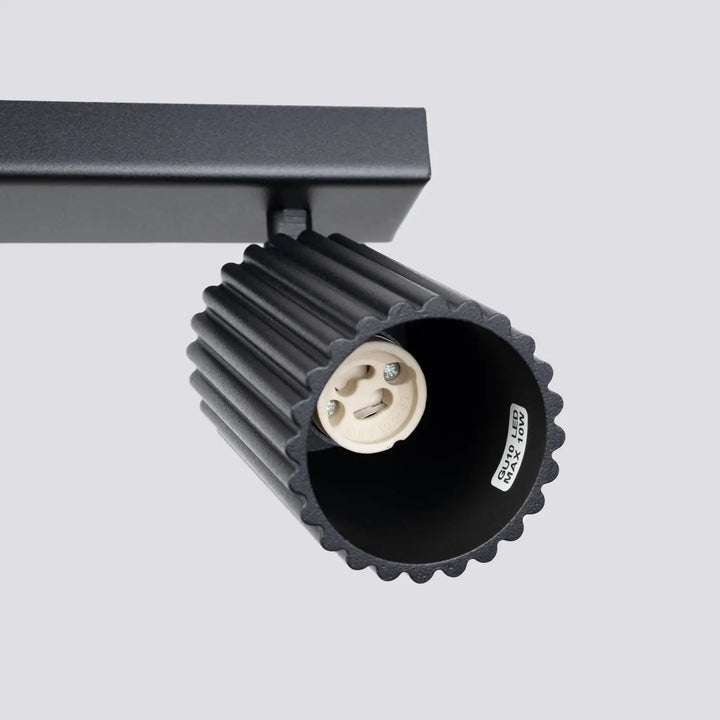 Plafonnier karbon allie design minimaliste en noir avec logement cylindrique strié et douille ampoules gu10 interchangeables