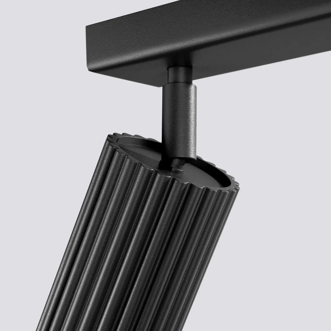Plafonnier karbon allie noir mat avec corps cylindrique à rainures verticales et ampoules gu10 interchangeables design minimaliste