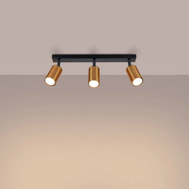 Luminaire plafonnier winx 3 noir avec trois spots cylindriques ajustables finition cuivre pour un design winx allie moderne