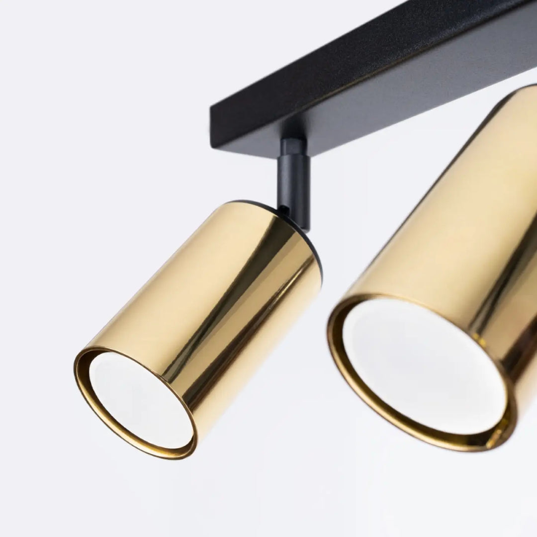 Luminaire plafonnier winx 3 noir cooper avec lampes cylindriques dorées au design minimaliste moderne