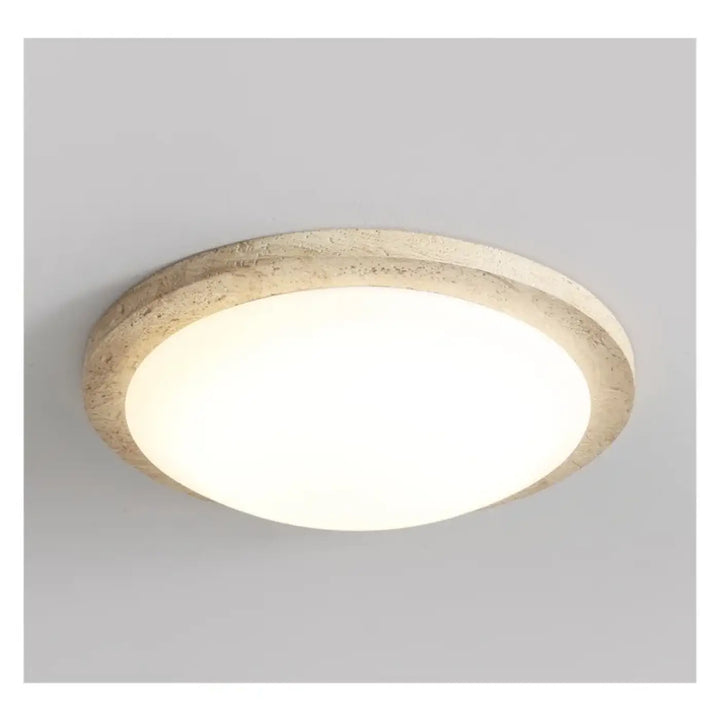 Luminaire plafonnier rond blanc en travertin au style épuré