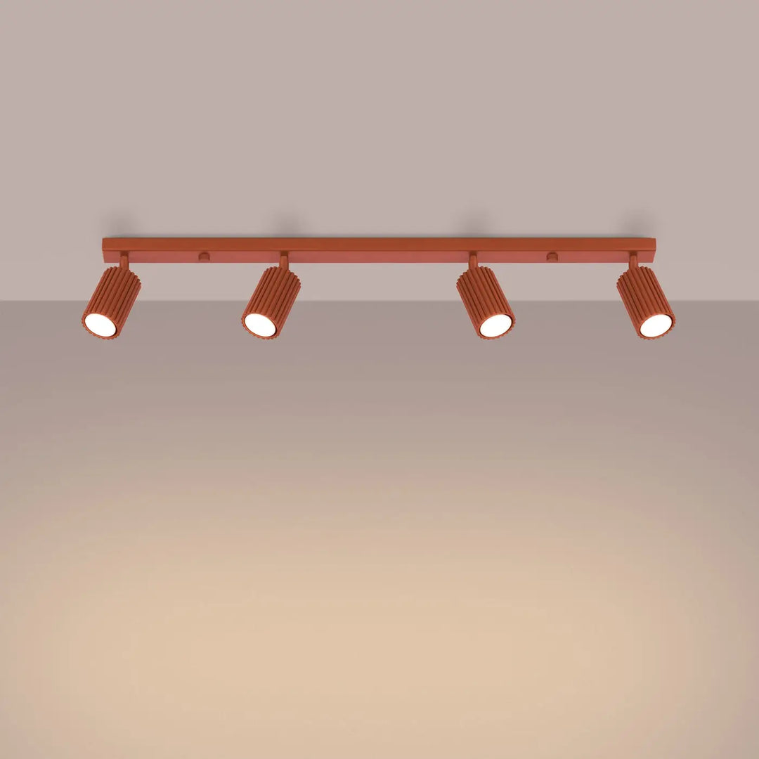 Plafonnier karbon allie cuivre avec quatre spots cylindriques nervurés et ampoules gu10 interchangeables style minimalisme