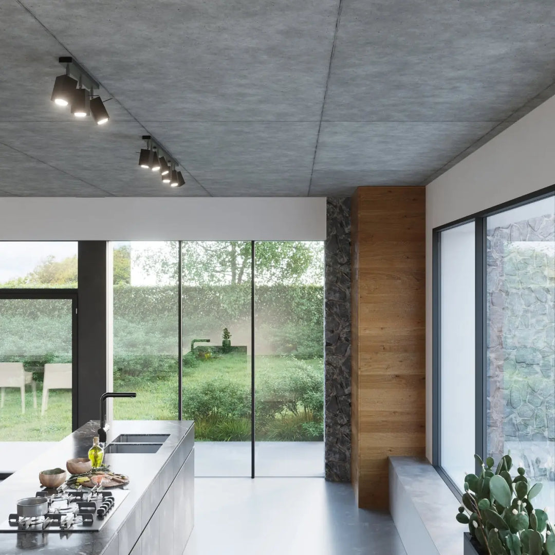 Plafonnier moderne merida 2 noir avec flux lumineux précis pour une cuisine contemporaine aux plans en béton et fixtures noires