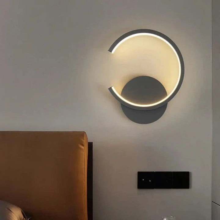 Applique murale led carl avec design circulaire minimaliste noir mat et anneau lumineux intégré pour solution déclairage moderne