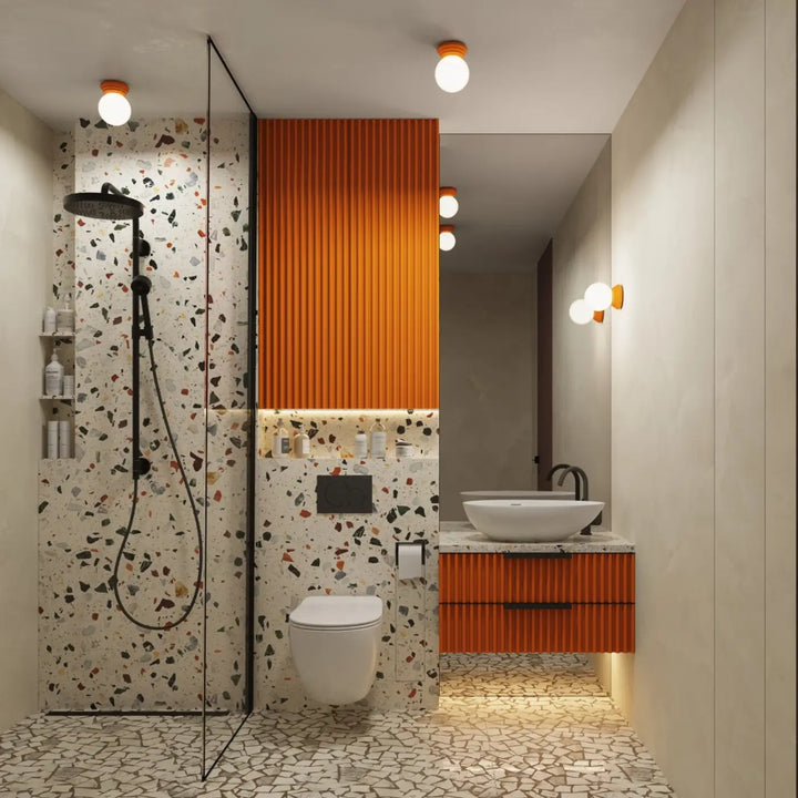 Luminaire plafonnier orange dans une salle de bains