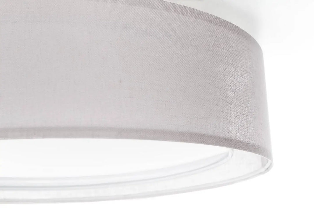 Luminaire plafonnier puRO gris design en tissu gris clair cylindrique avec texture tissée subtile et bords arrondis propres