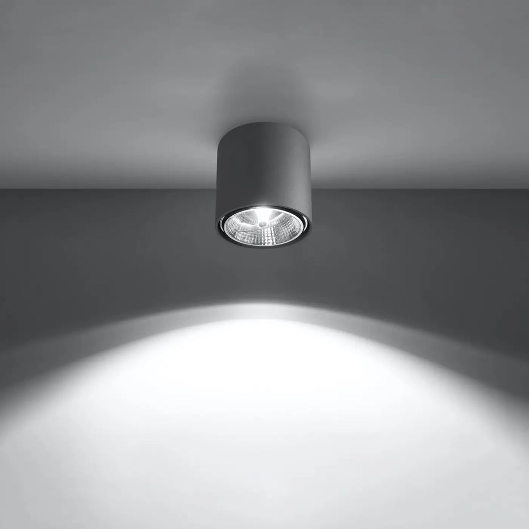 Plafonnier tiube gris moderne avec forme minimaliste et lentille texturée émettant une lumière blanche éclatante