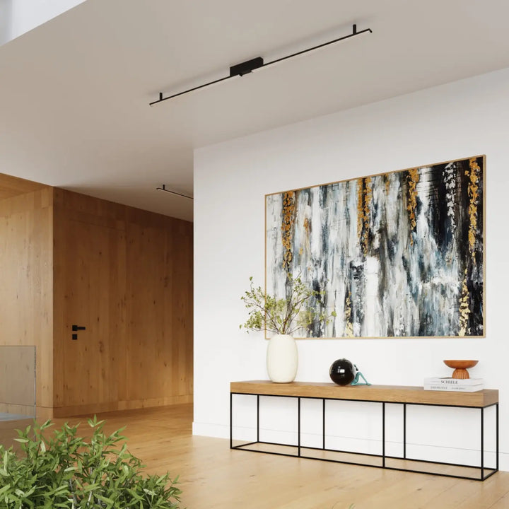 Plafonnier linéaire LAGOM noir dans un intérieur contemporain