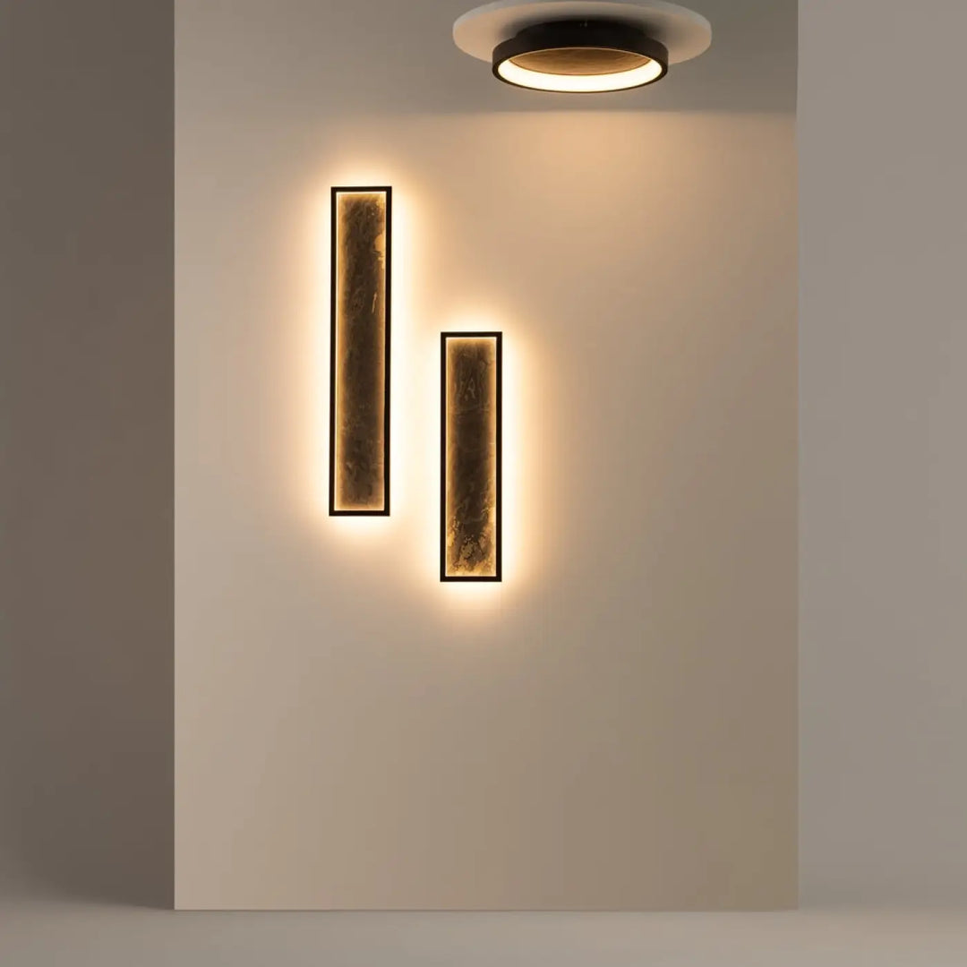 Modern plafonnier orign effet pierre avec cadre noir et lumière chaude ambre pour un éclairage mural élégant