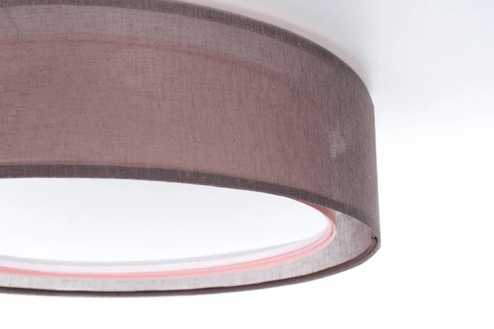 Luminaire plafonnier puro violet design rond avec abat-jour en tissu taupe texturé et bord intérieur rose pâle