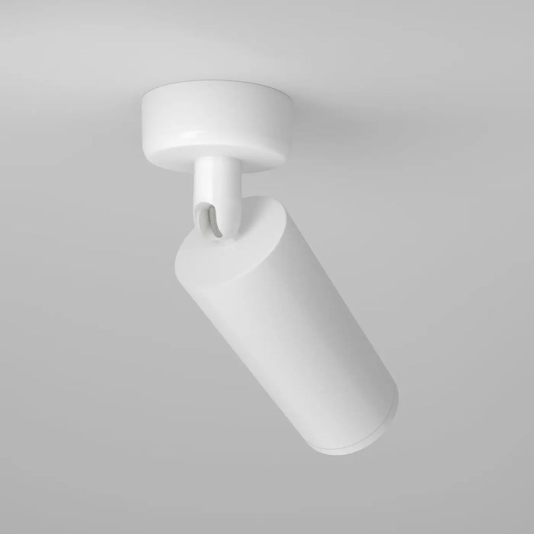 Spot directionnel blanc avec base ronde et design minimaliste pour un éclairage focus directionnel efficace