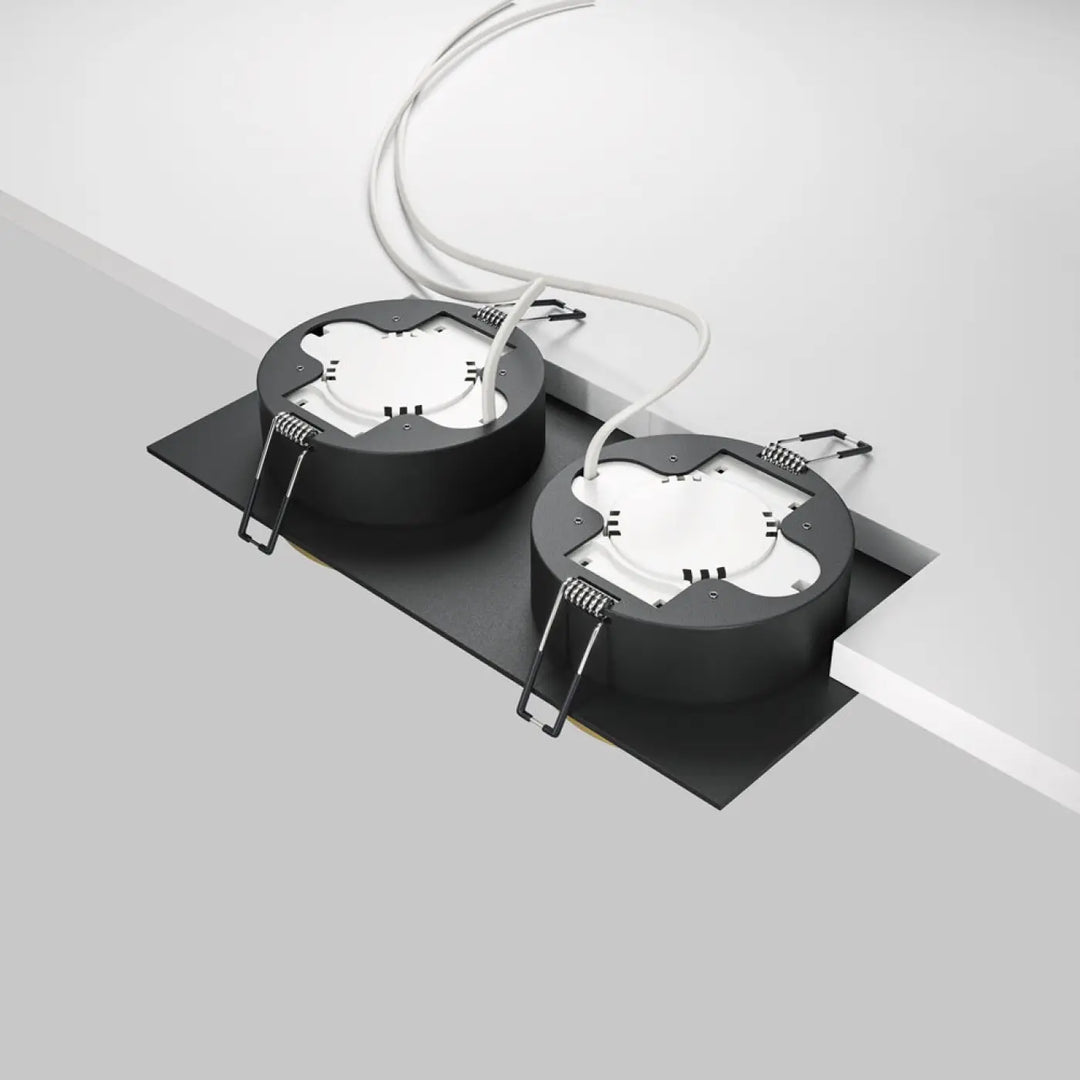Spot hoop double noir avec composants internes blancs et câblage visible pour éclairage encastré plafond