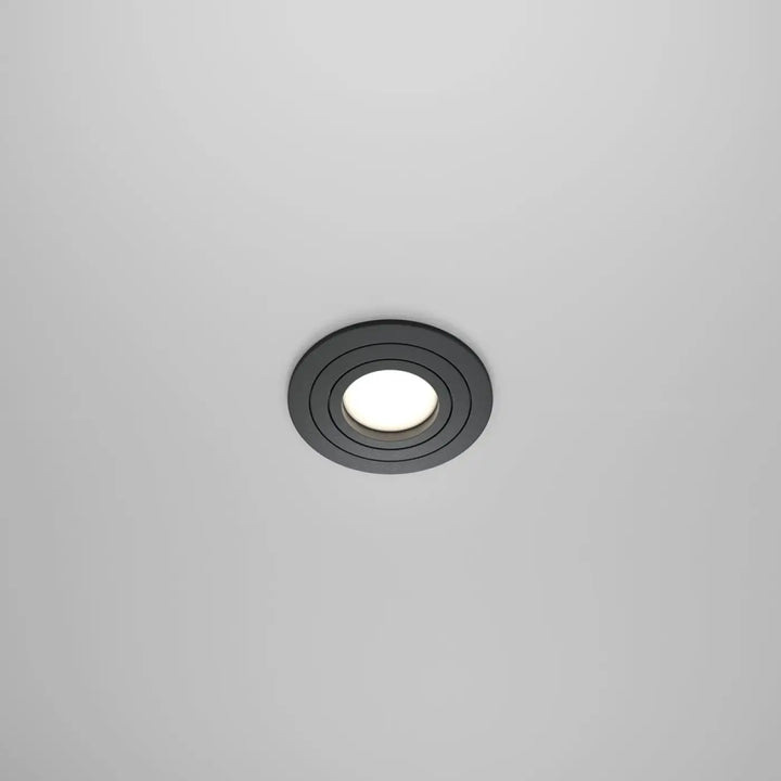 Spot encastrable rond noir avec ampoule gu10 orientable et centre lumineux blanc pour éclairage intérieur