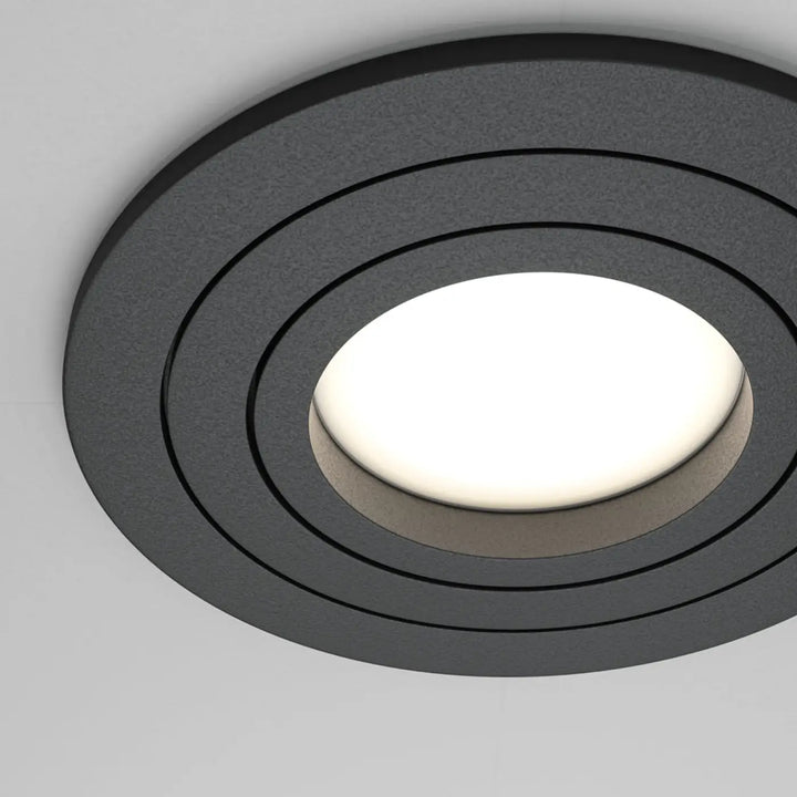 Spot encastrable rond atom noir avec anneaux concentriques lumineux et ampoule gu10 orientable blanche bright