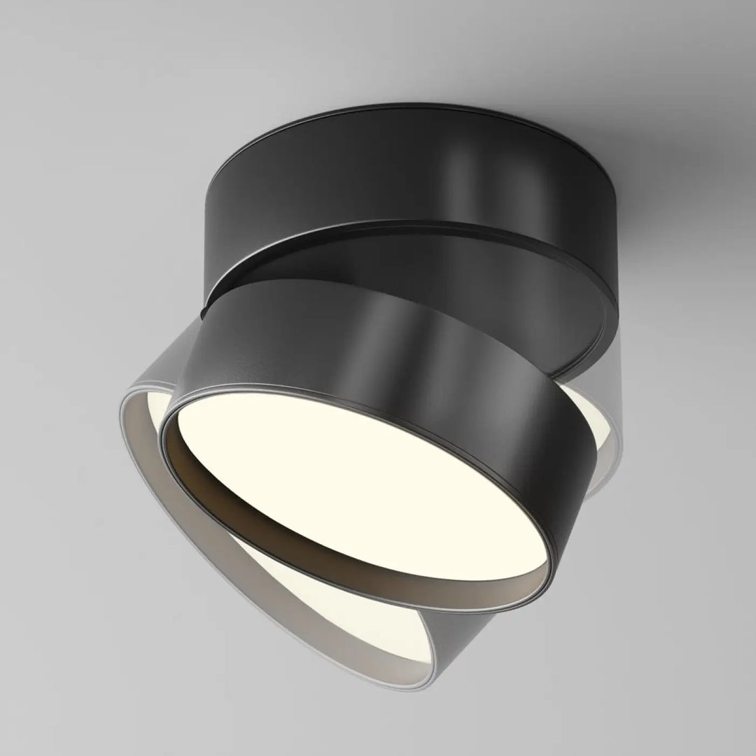 Spot onda disque rétractable spot encastrable en métal noir mat avec anneaux circulaires et centre lumineux blanc doux