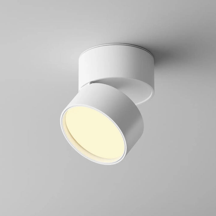 Spot encastrable onda disque rétractable blanc en aluminium avec lumière chaude jaune et design moderne minimaliste
