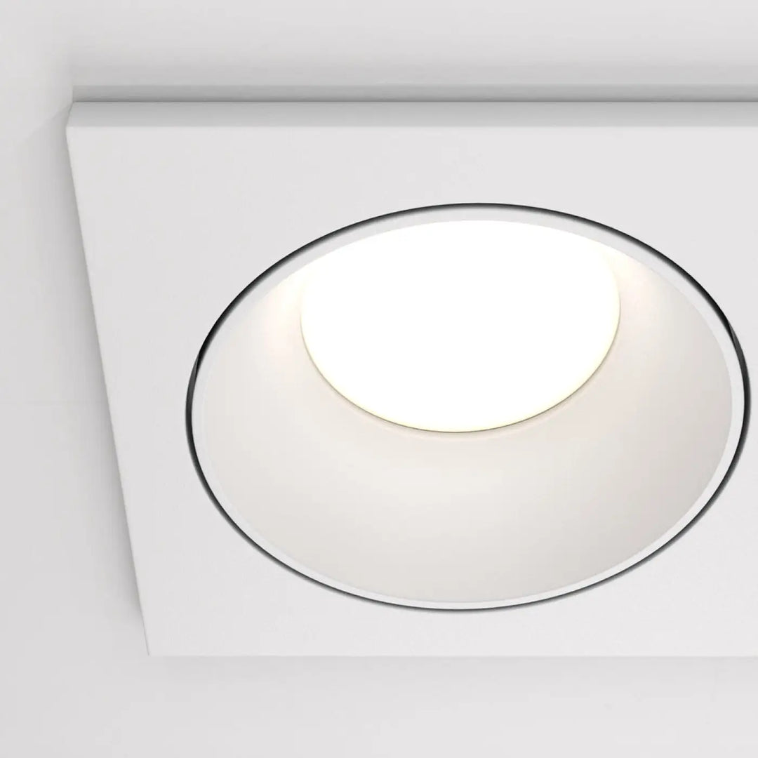 White square recessed ceiling light with circular glowing center and black trim for spot zoom double installation