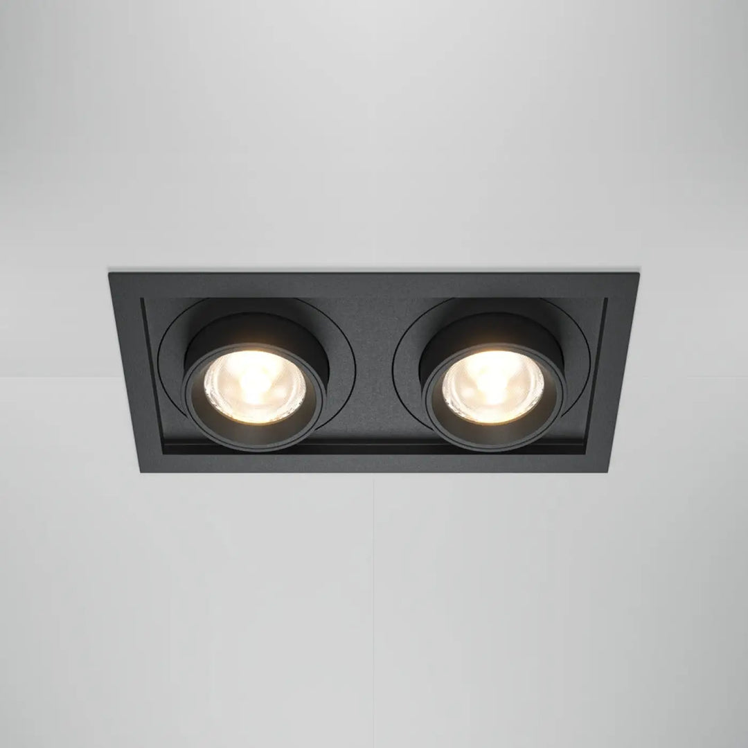 Spot hidden led rétractable en acier noir avec deux ampoules circulaires intégrées dans un cadre rectangulaire