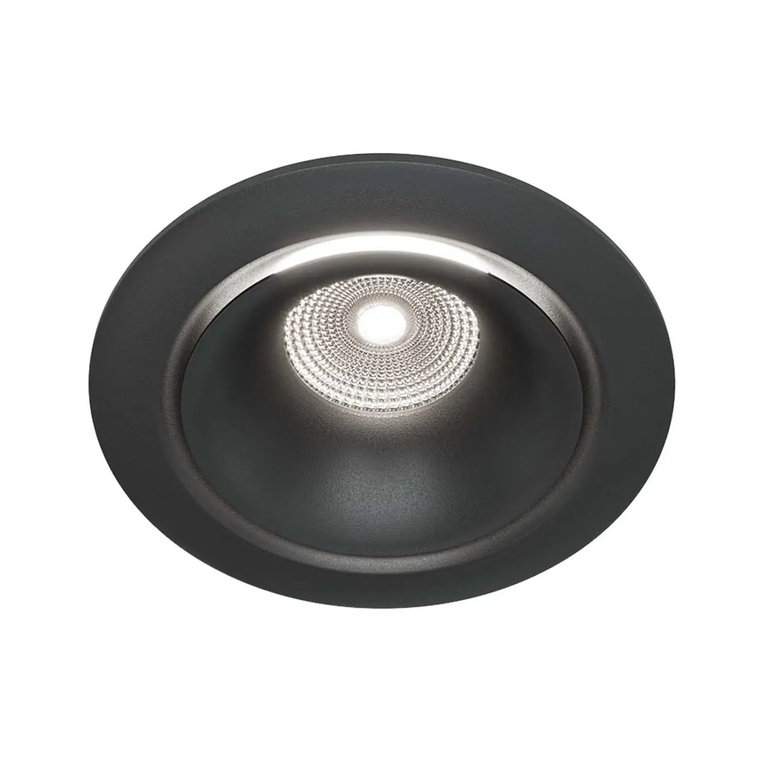 Spot yin led intégrée noir mat avec réflecteur argent texturé et ampoule centrale blanc chaud éclairée