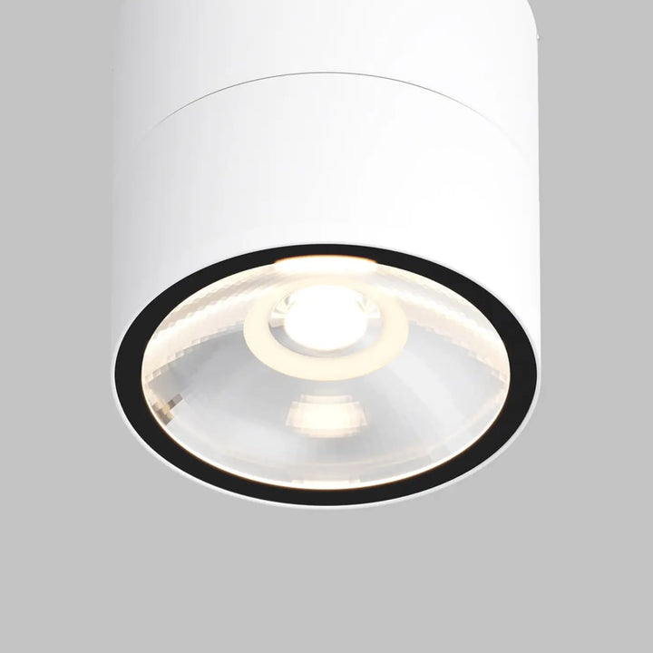 Spot spin led orientable encastré blanc cylindrique avec cadre noir et lentille en verre transparent