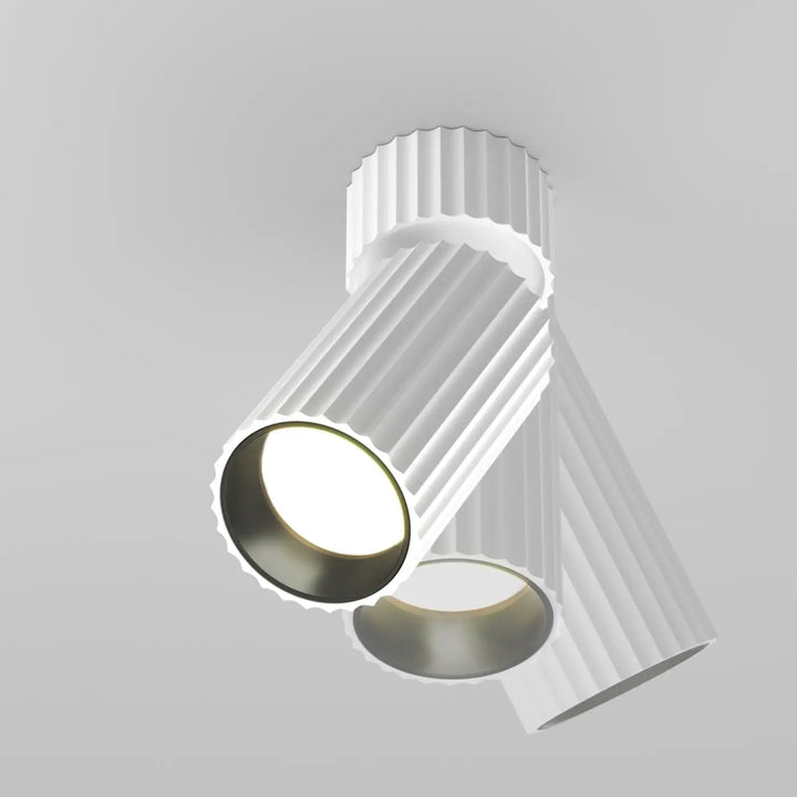 Spot orientable calipso cylindre cannelé blanc avec anneau métallique intérieur moderne et plafond monté