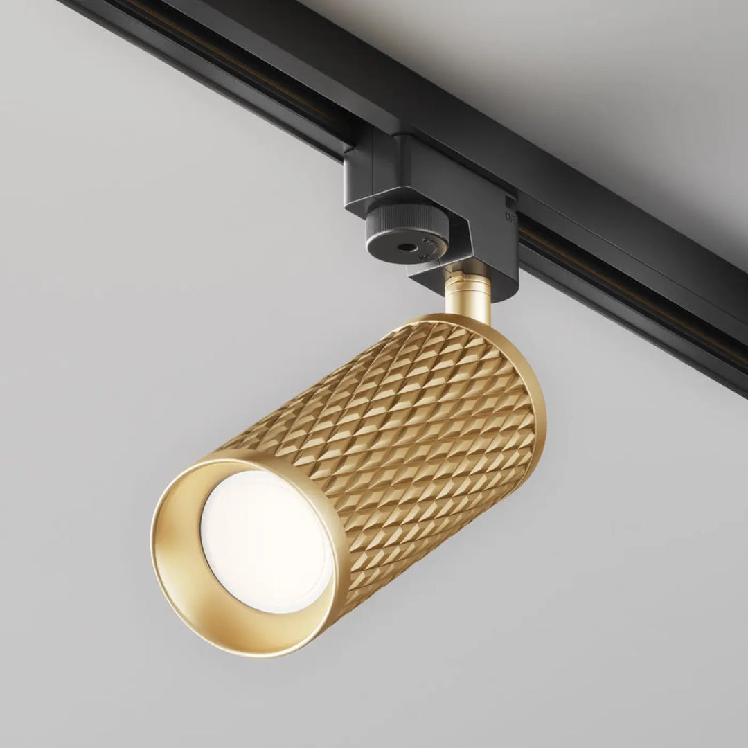 Spot orientable focus design doré avec tête texturée en diamant et support noir pour éclairage moderne